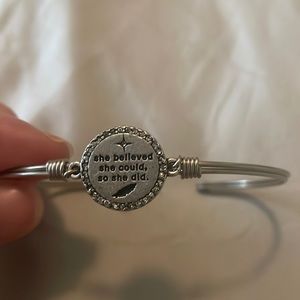 L&D Silver bracelet with latch. Says “She believed she could. So she did”